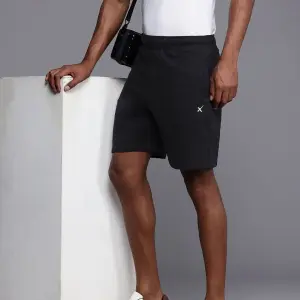 HRX by Hrithik Roshan Men Black Solid Shorts (28) by SANKAN